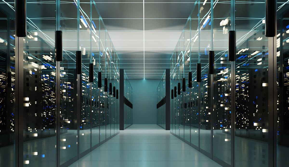 A spacious data center hallway filled with rows of servers
