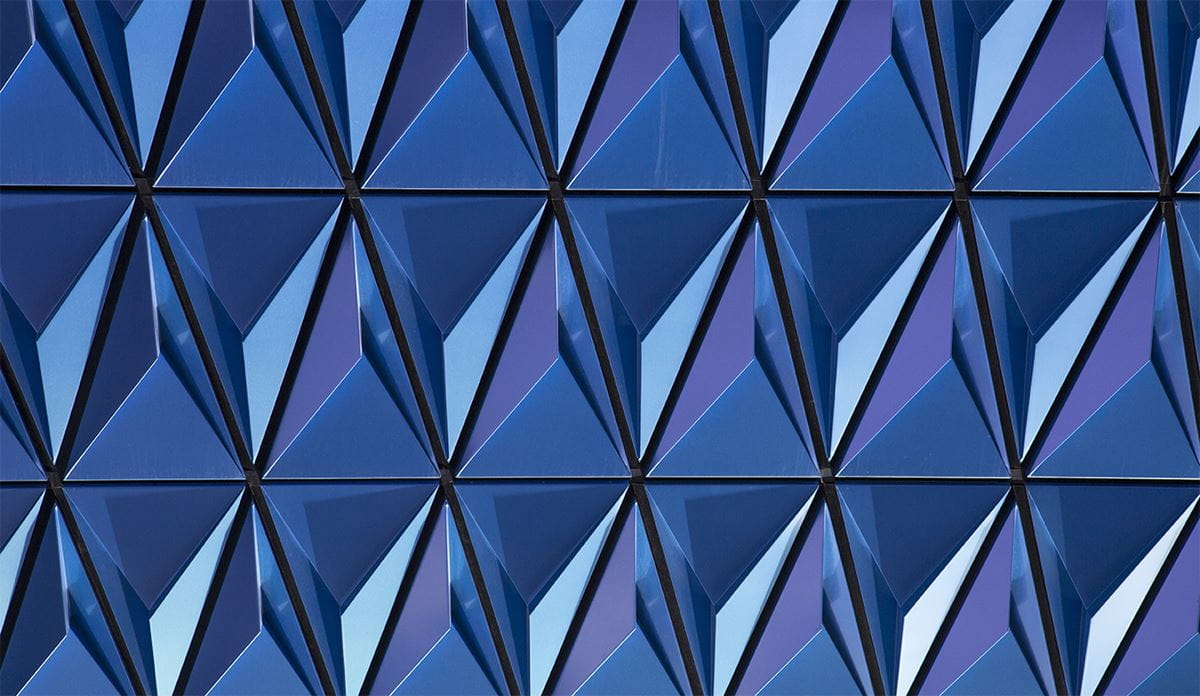 A blue structure adorned with prominent triangular designs