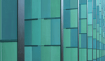 Blue-green glass facade with metal frames