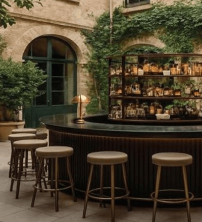 Outdoor bar with high stools around counter