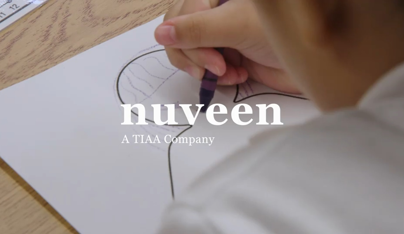 A girl draws on paper